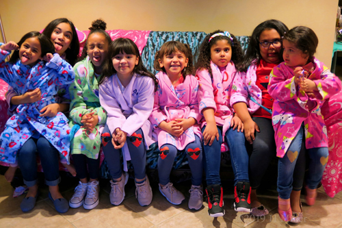 Party Guests Sitting On The Couch With Beautiful Smiles For The Group Photo! Party Guests Sitting On The Couch With Beautiful Smiles For The Group Photo!