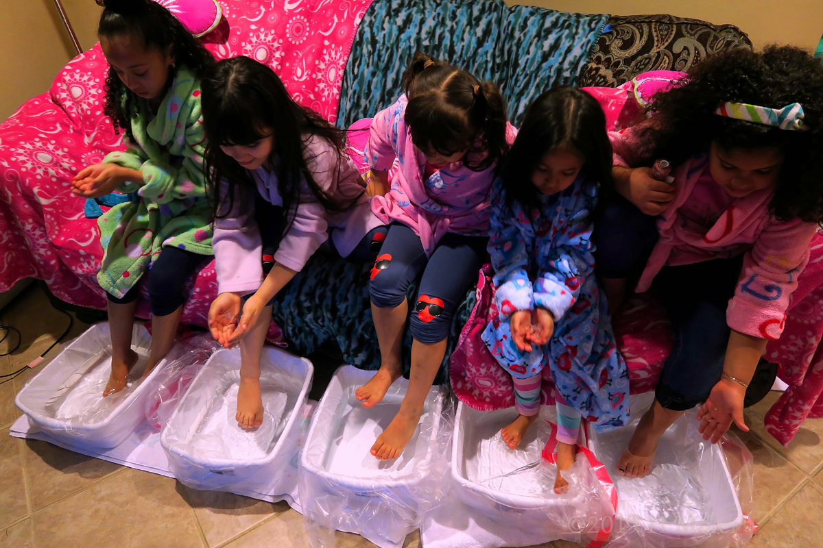 A Group Of Party Guests Enjoying Pedicures For Girls At The Spa Party 