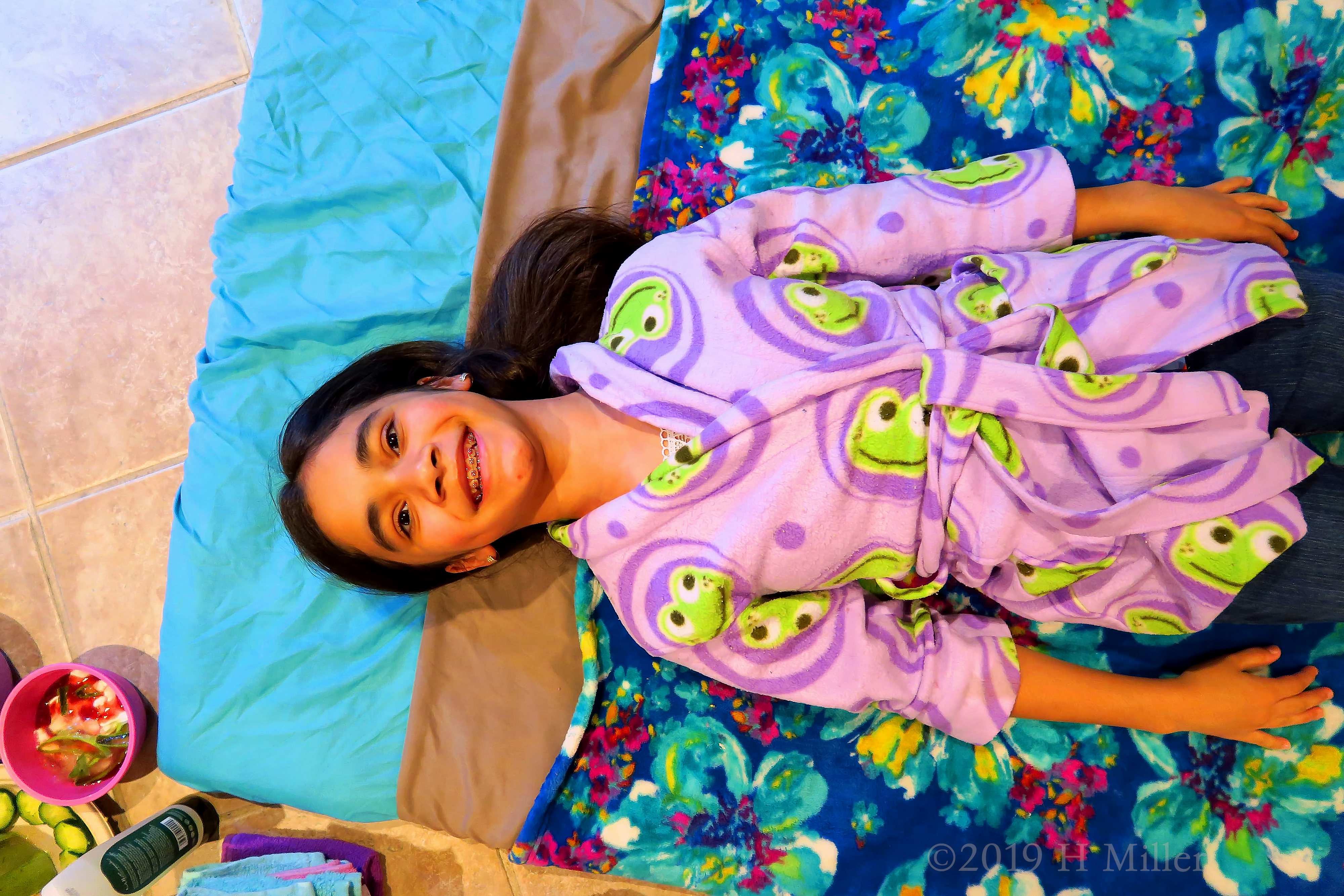 Party Guest Wearing A Spa Robe Smiling For Her Before Kids Facial Picture Party Guest Wearing A Spa Robe Smiling For Her Before Kids Facial Picture