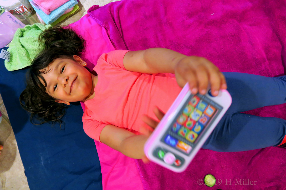 Birthday Party Guest Showing Her Toy Before Her Kids Facial At The Spa Birthday Party Birthday Party Guest Showing Her Toy Before Her Kids Facial At The Spa Birthday Party