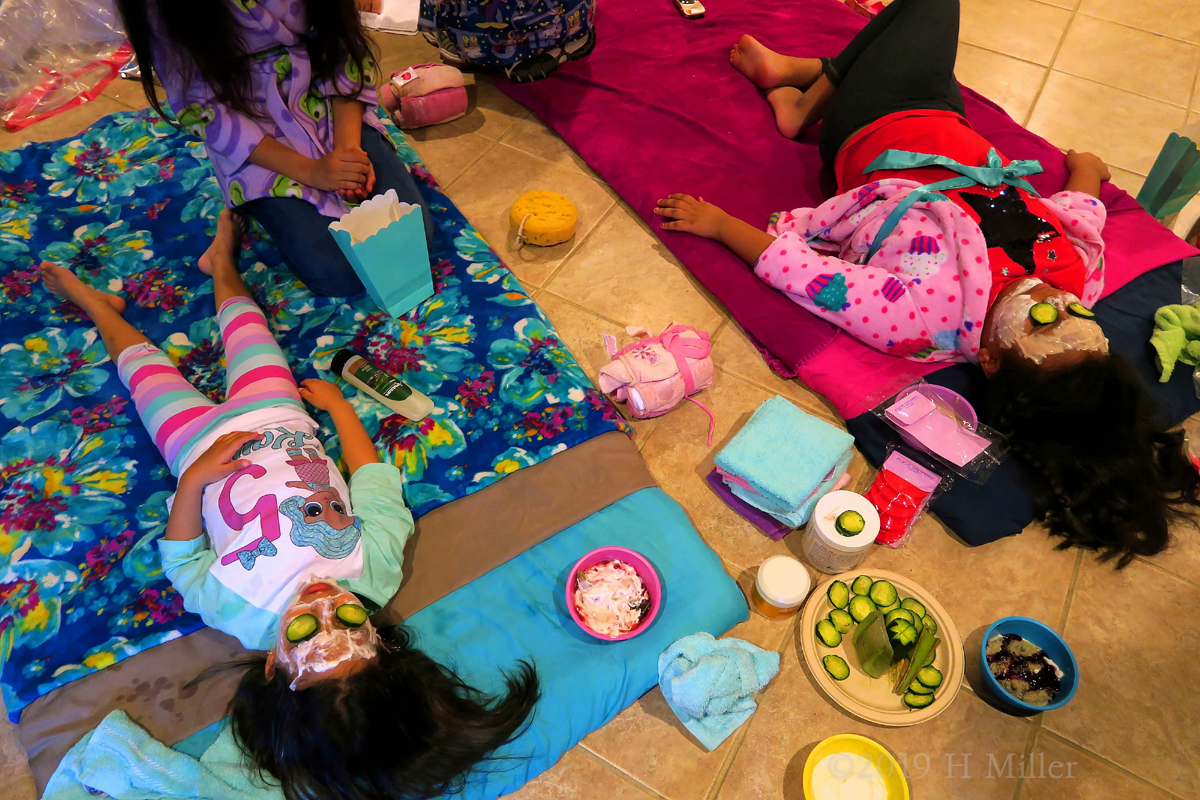 Party Guests Enjoying Facials For Girls With Cucumbers And Face Masque! Party Guests Enjoying Facials For Girls With Cucumbers And Face Masque!