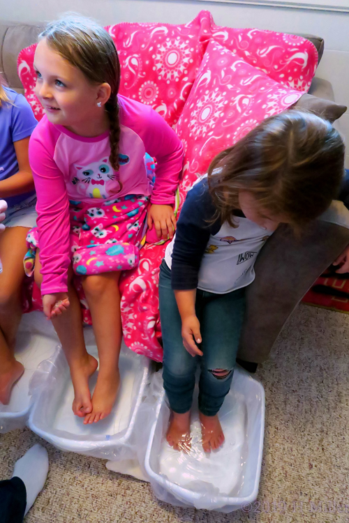 Adding Fizzy Salt To The Kids Pedicure Footbaths.