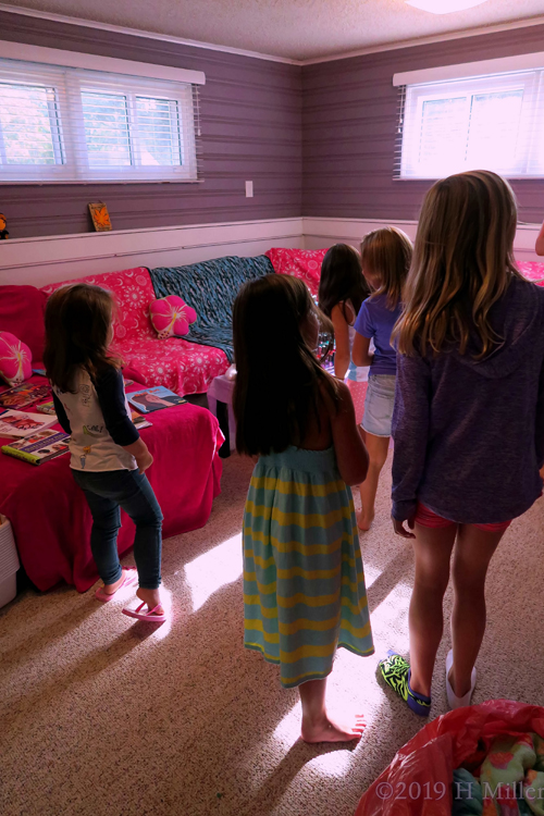 Birthday Girl And Guests Gather Round Birthday Girl And Guests Gather Round