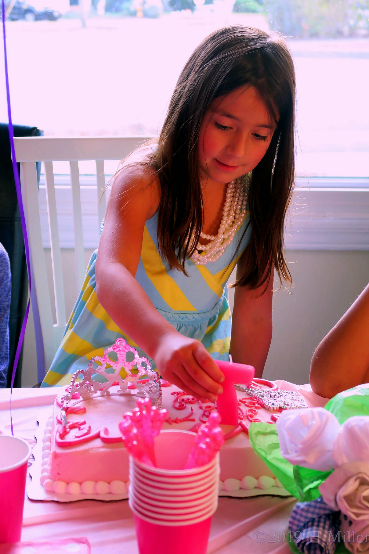 Adding Her Birthday Candles 