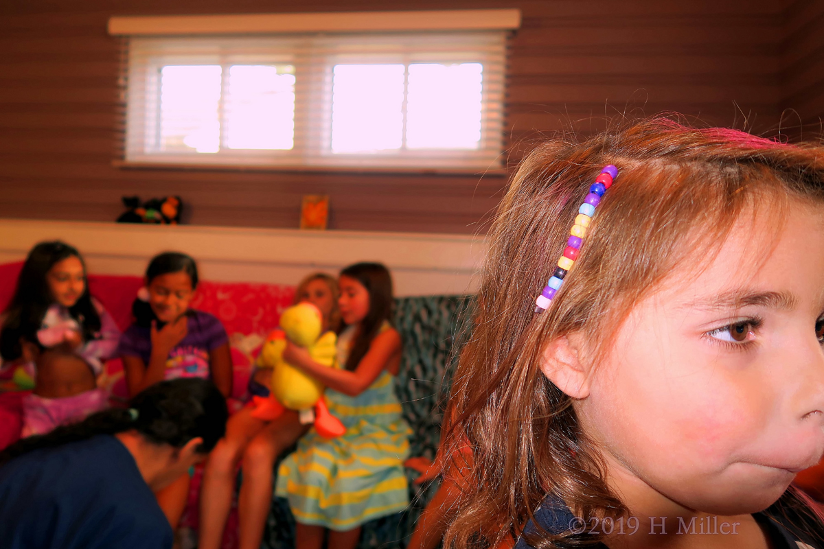 Multi Colored Beads Bring Out Her Kids Hairstyle 