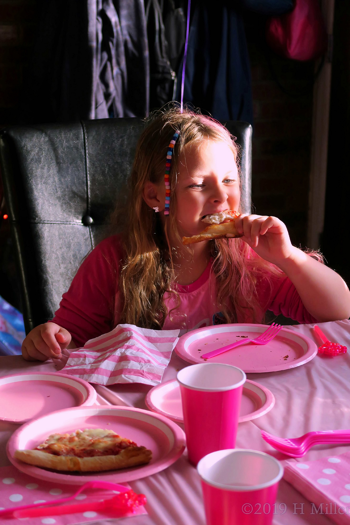 Party Guest Enjoying Her Pizza Slice 