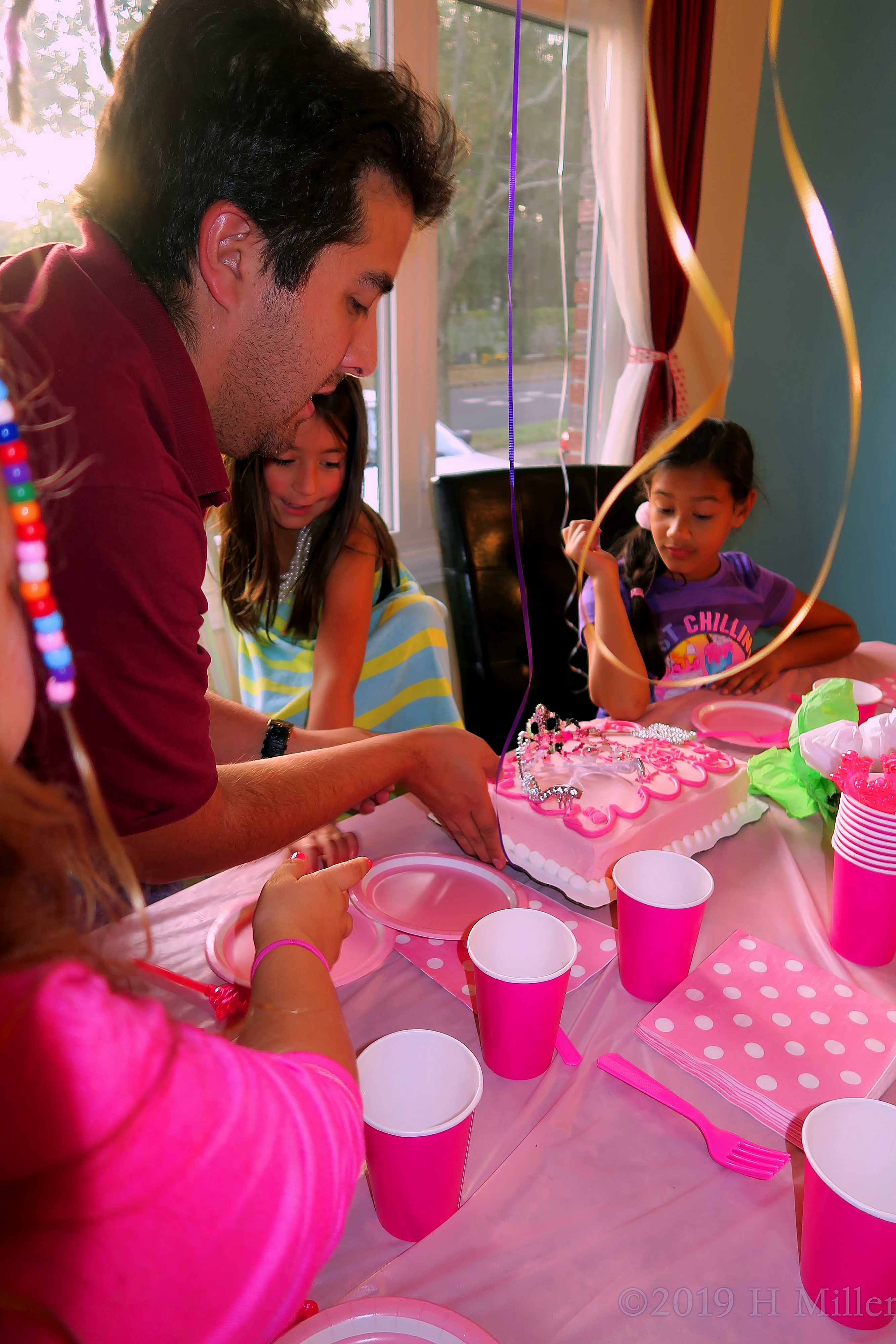 Dad Putting Candles On The Birthday Cake Dad Putting Candles On The Birthday Cake