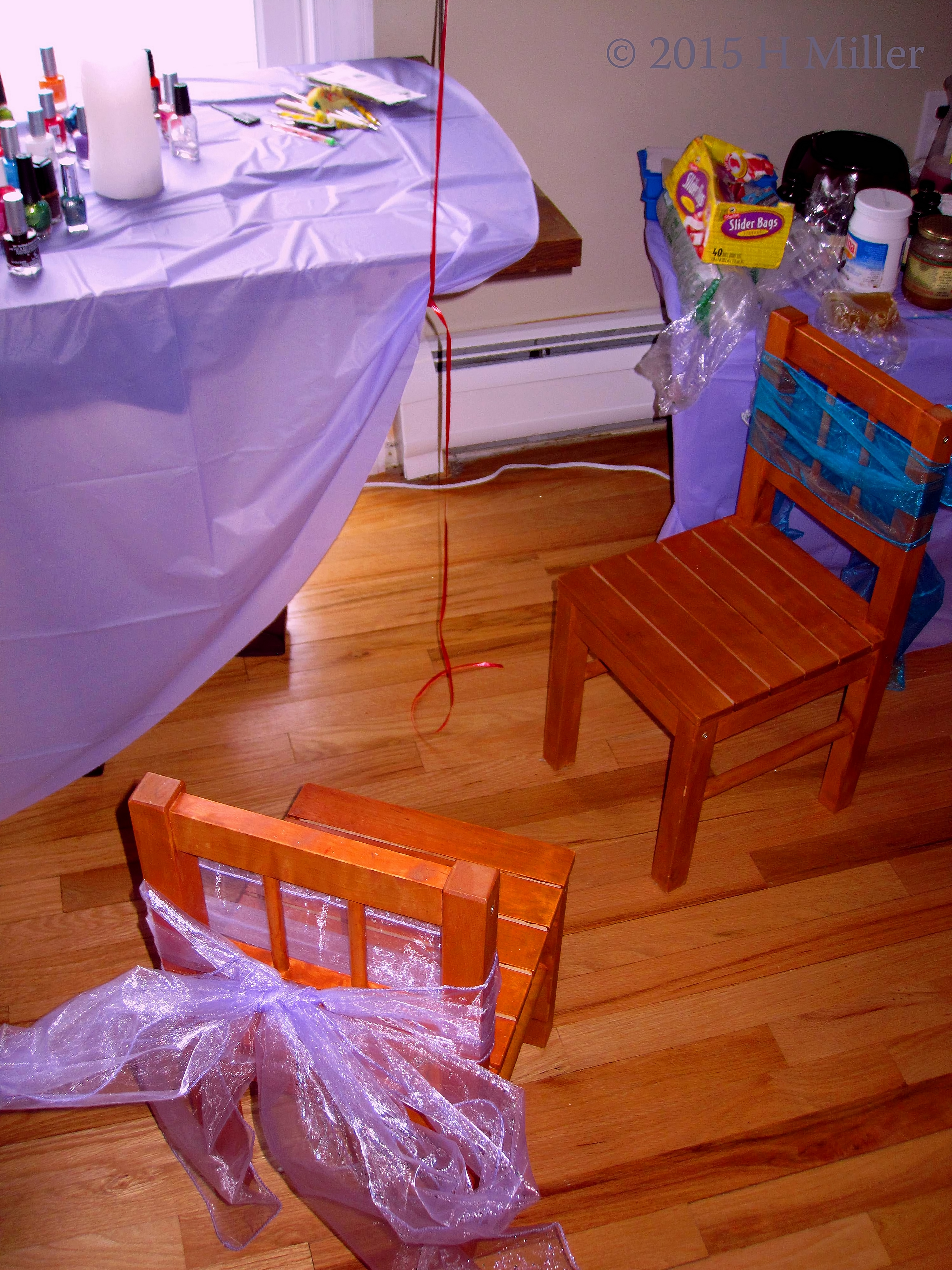 Chairs Styled With Pretty Bows To Set The Decor. 