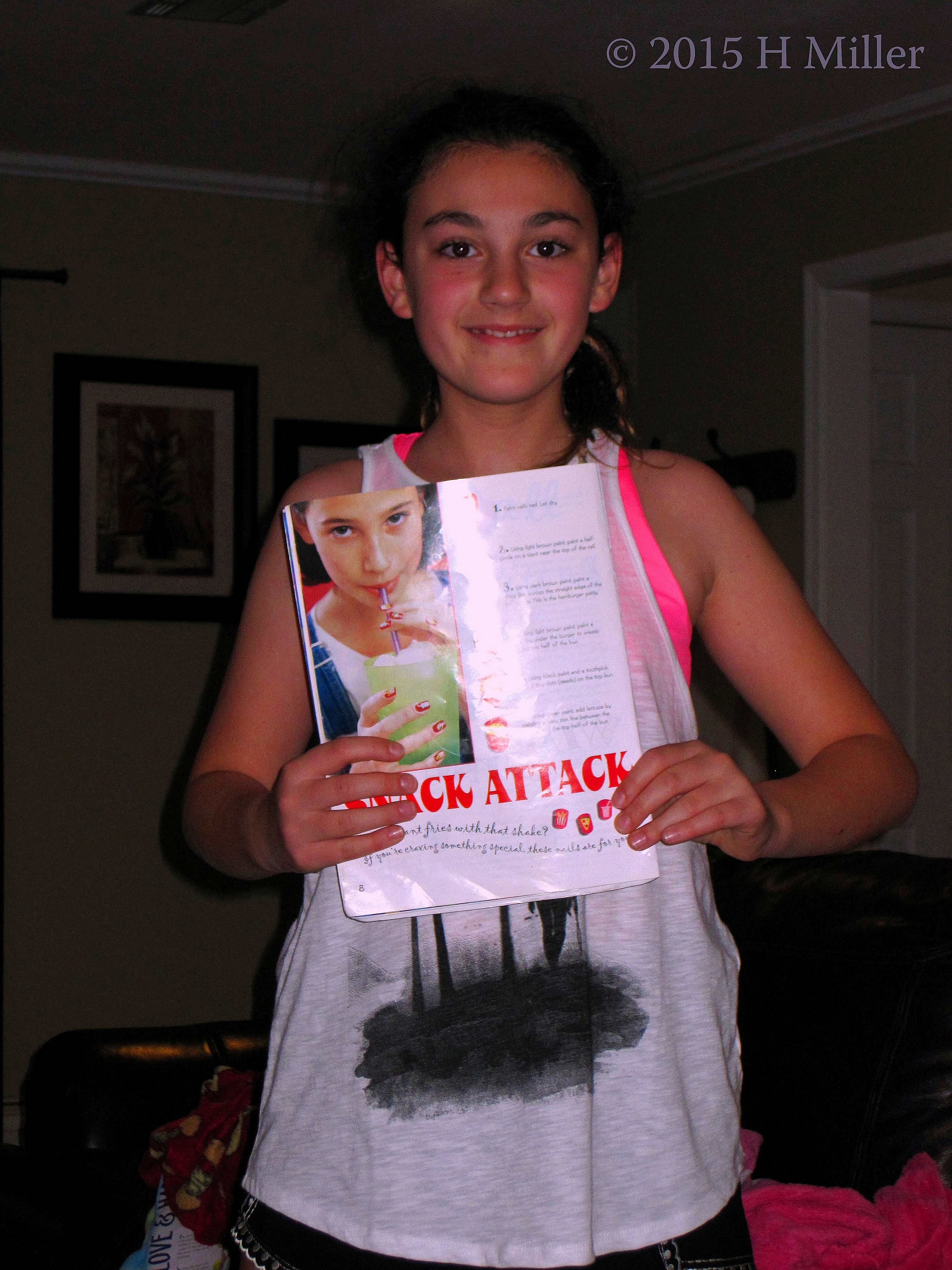 Kelsey Checking Out A Book Of Designs. Kelsey Checking Out A Book Of Designs.