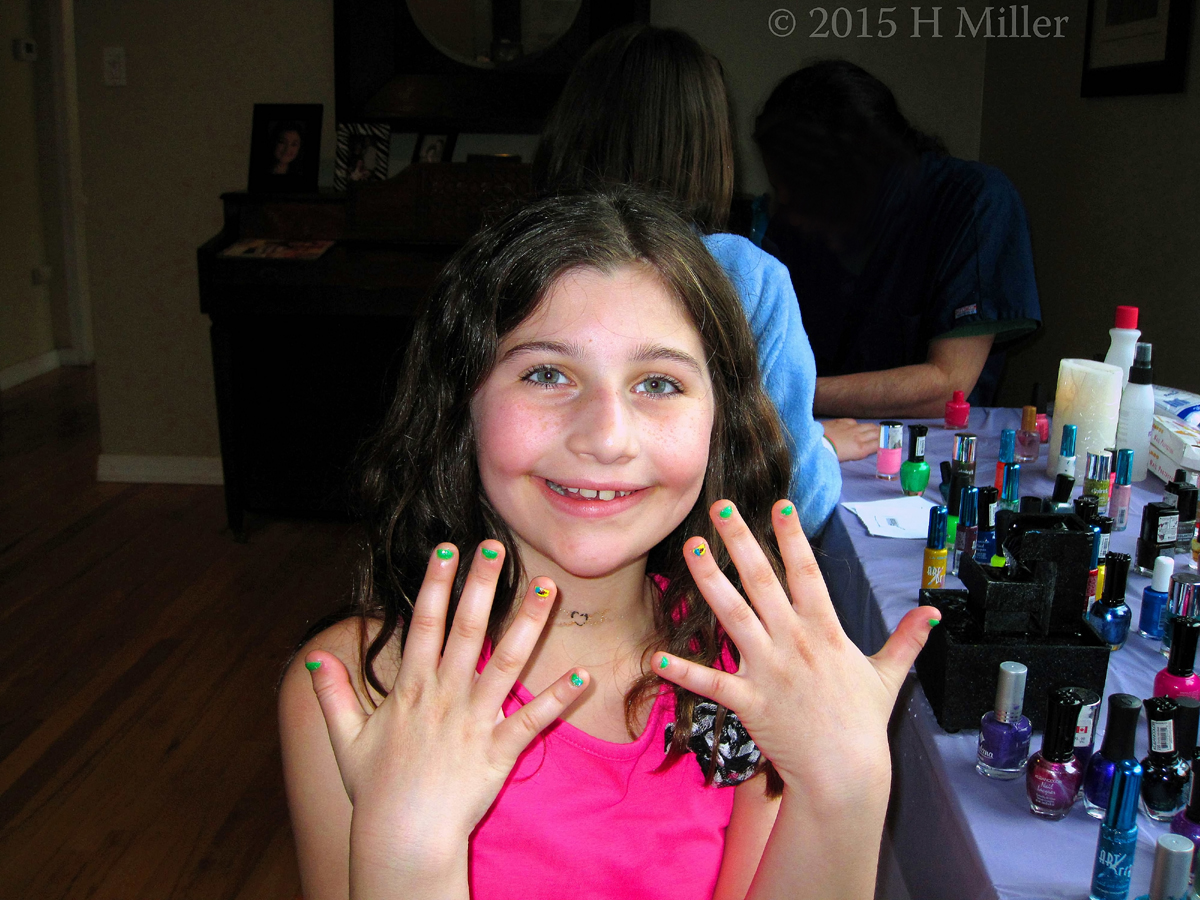 SHowing Off Her Cool Lime Green Tween Mini Mani With Ice Cream Cone Graphics. 