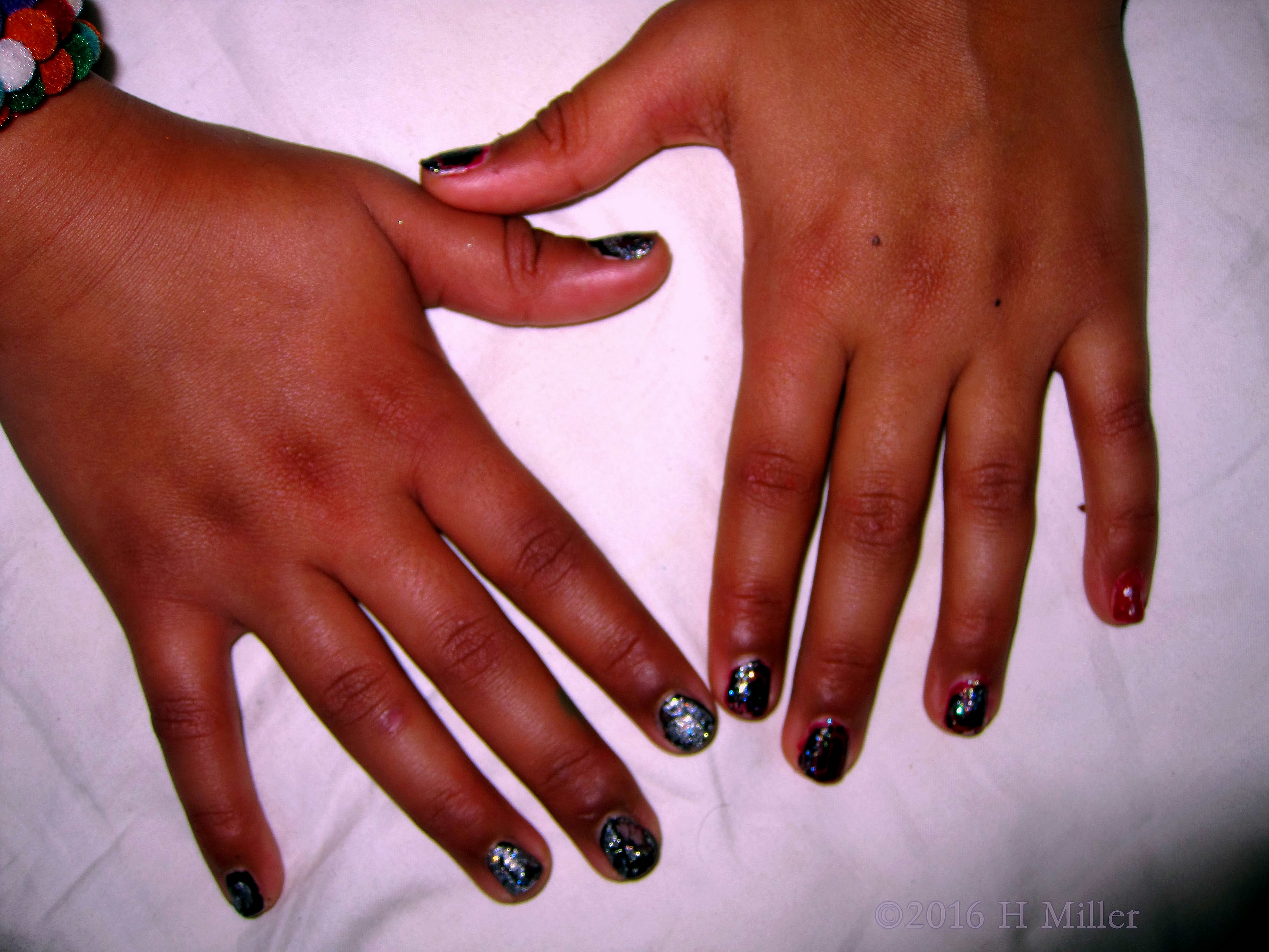 Cool Black And Glittery Manicure 