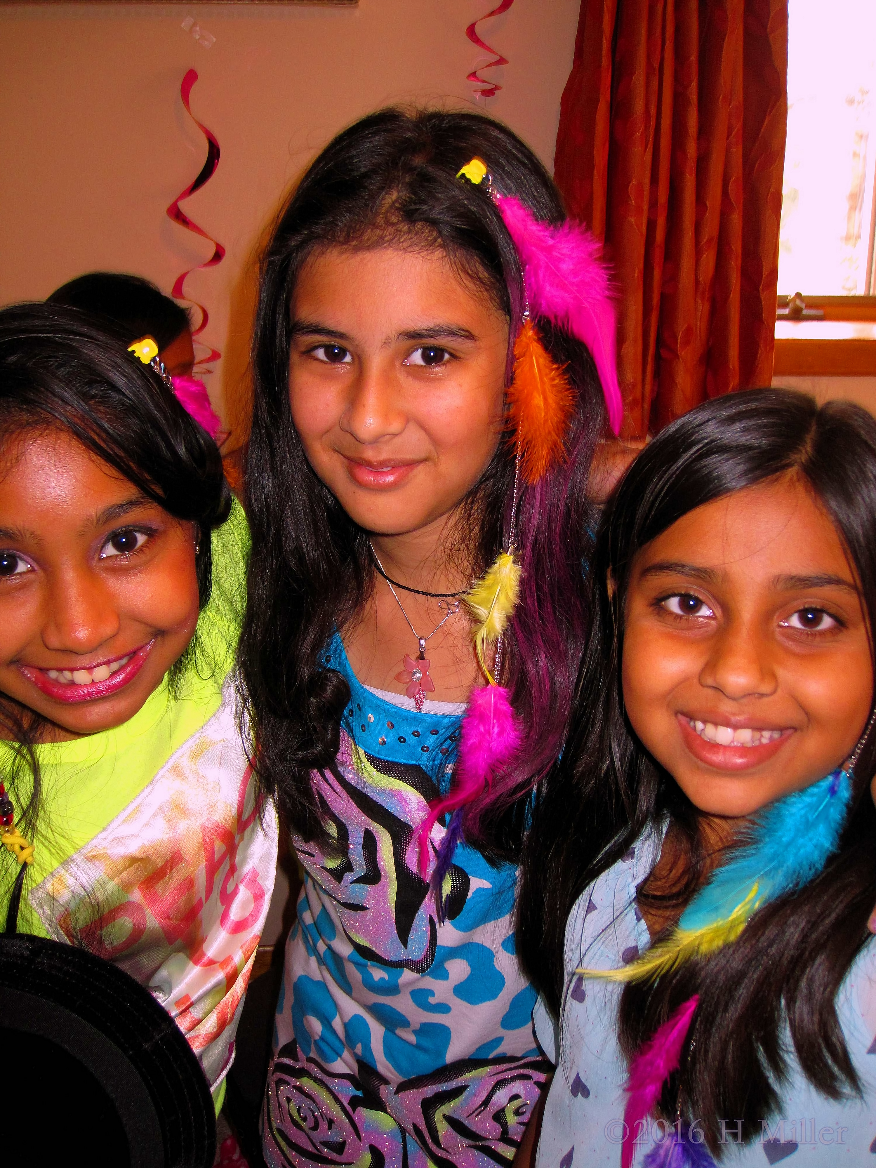 The Girls Look Awesome In Bright Feather Hair Extensions! The Girls Look Awesome In Bright Feather Hair Extensions!