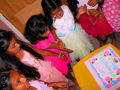 The Girls Are Admiring The Birthday Cake. The Girls Are Admiring The Birthday Cake.