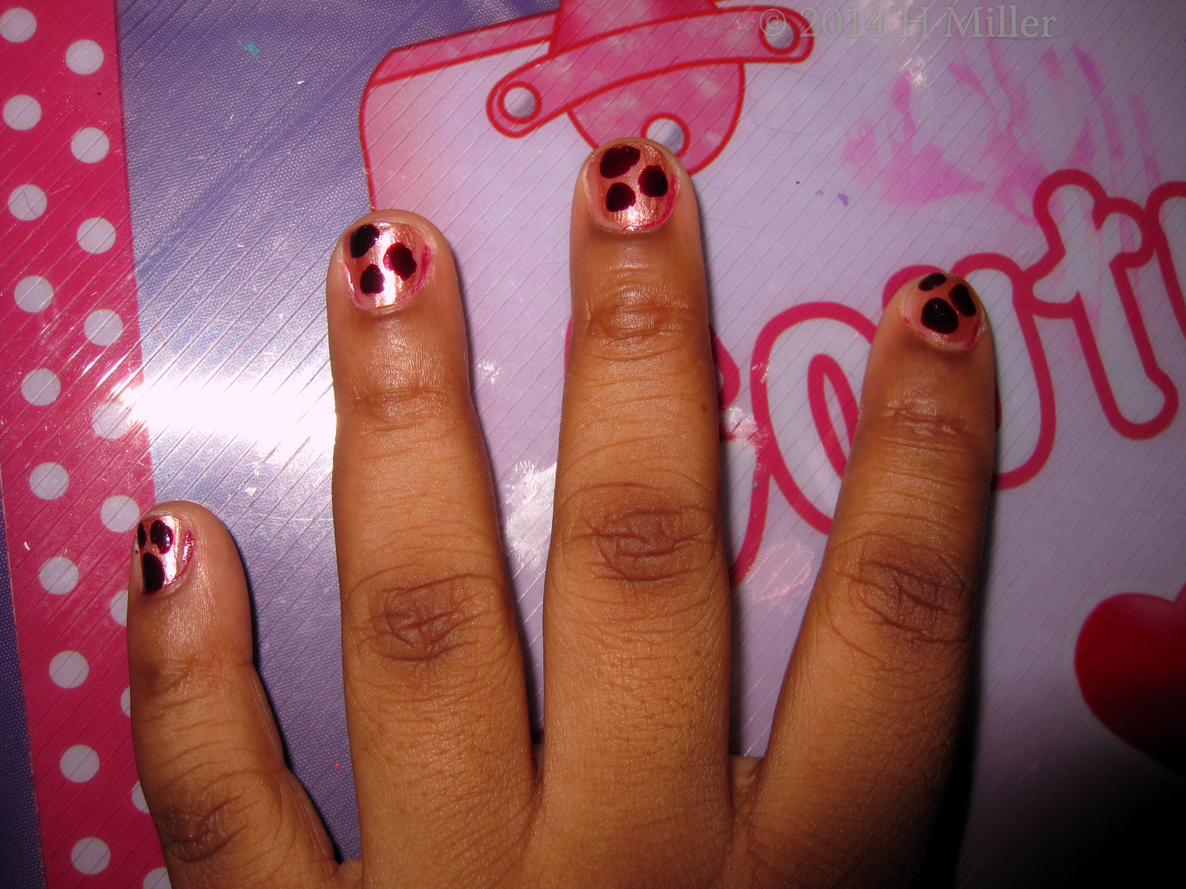 Kids Nail Art. Brown Leopard Spots On Metallic Copper Background 