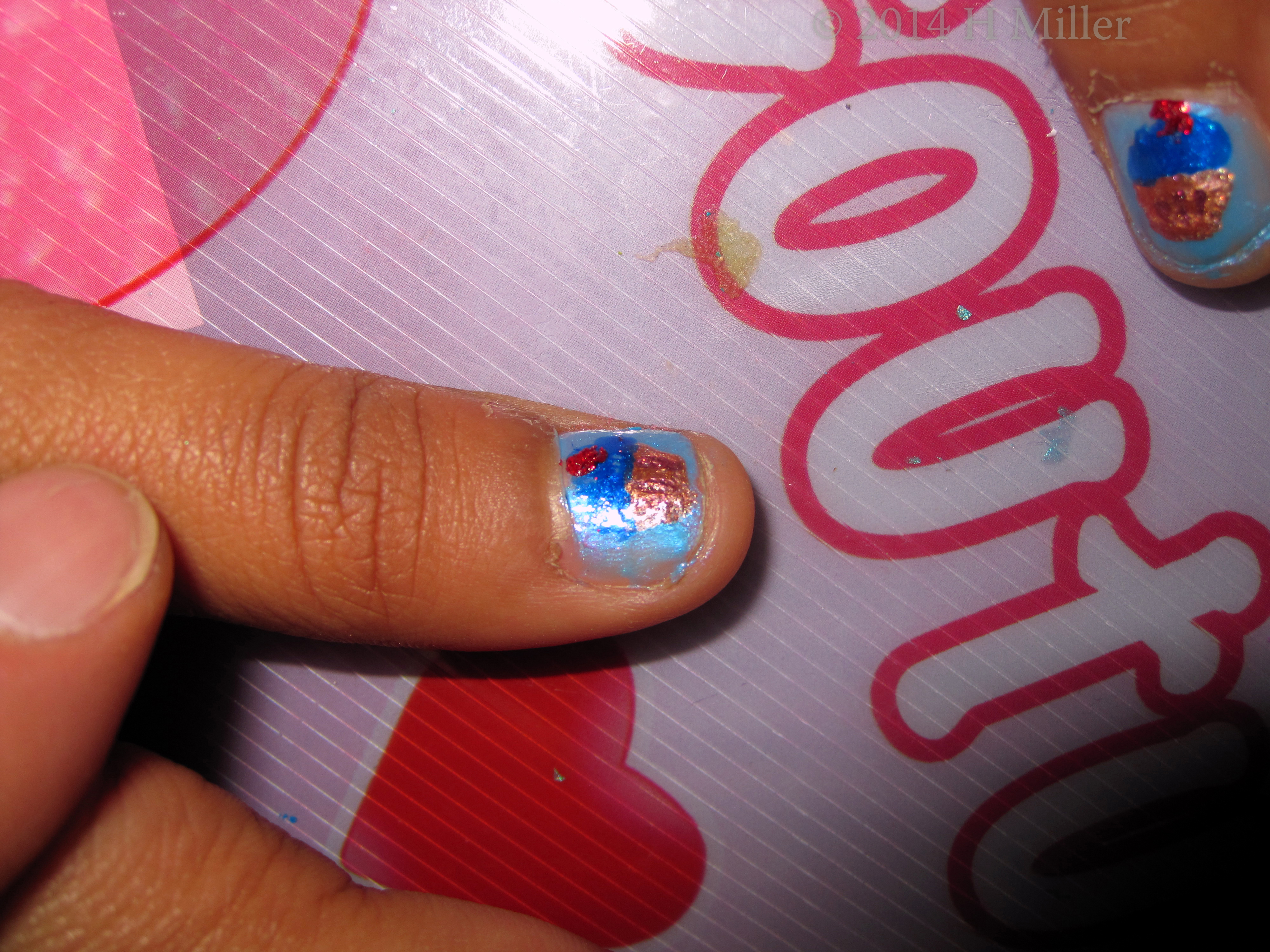 Tween Nail Art. Close Up Blueberry Frosted Cupcake On Metallic Powder Blue. 