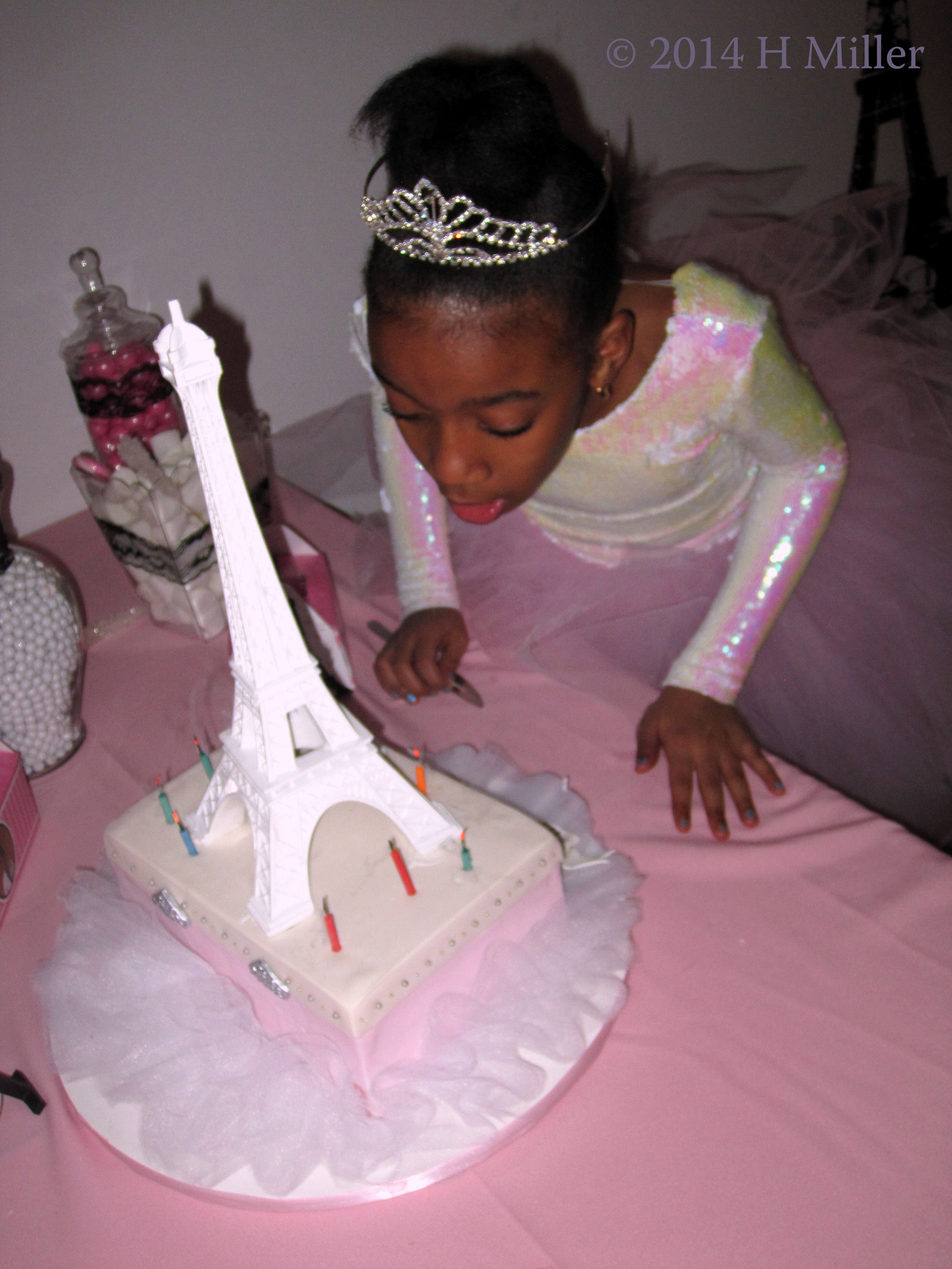 Blowing Out The Candles On The Spa Makeup Case Eiffel Tower Cake. Blowing Out The Candles On The Spa Makeup Case Eiffel Tower Cake.
