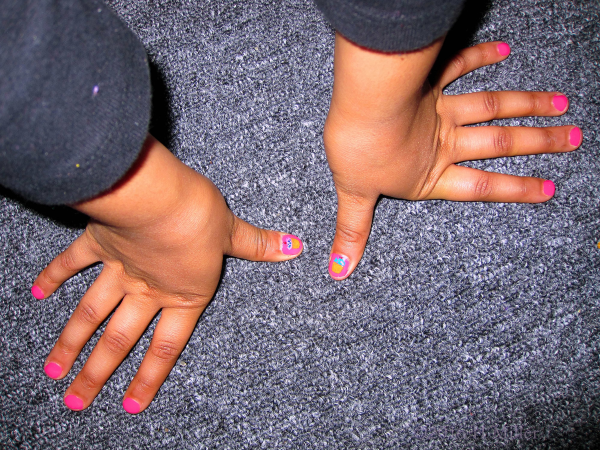 She Has Cupcakes On Her Thumbs! Sweet! 