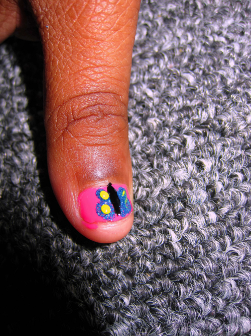 She Has A Butterfly On Her Nail!