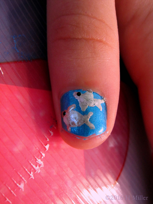 She Has Fish On Her Nail! What A Cute Nail Design.