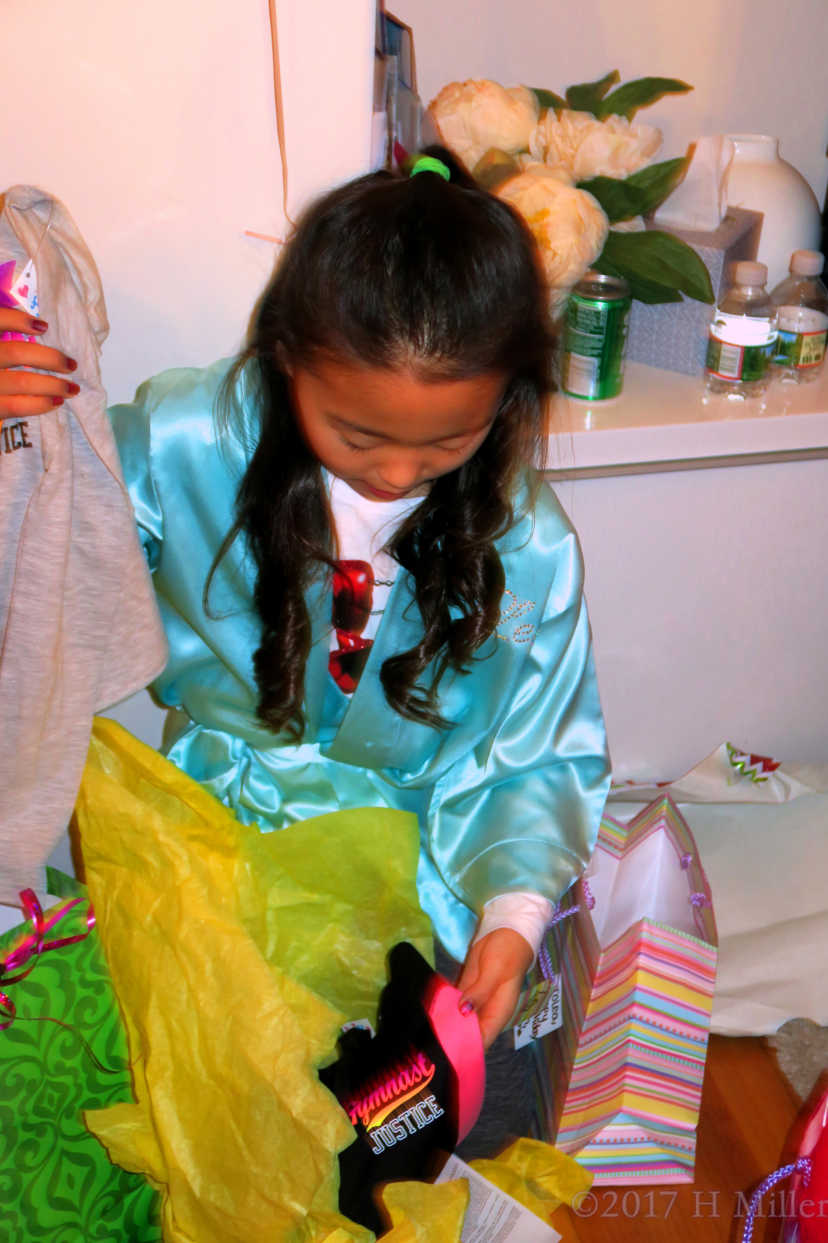 Along With The Grey T Shirt, Her Gifts Include One Black Shirt, Too! Along With The Grey T Shirt, Her Gifts Include One Black Shirt, Too!