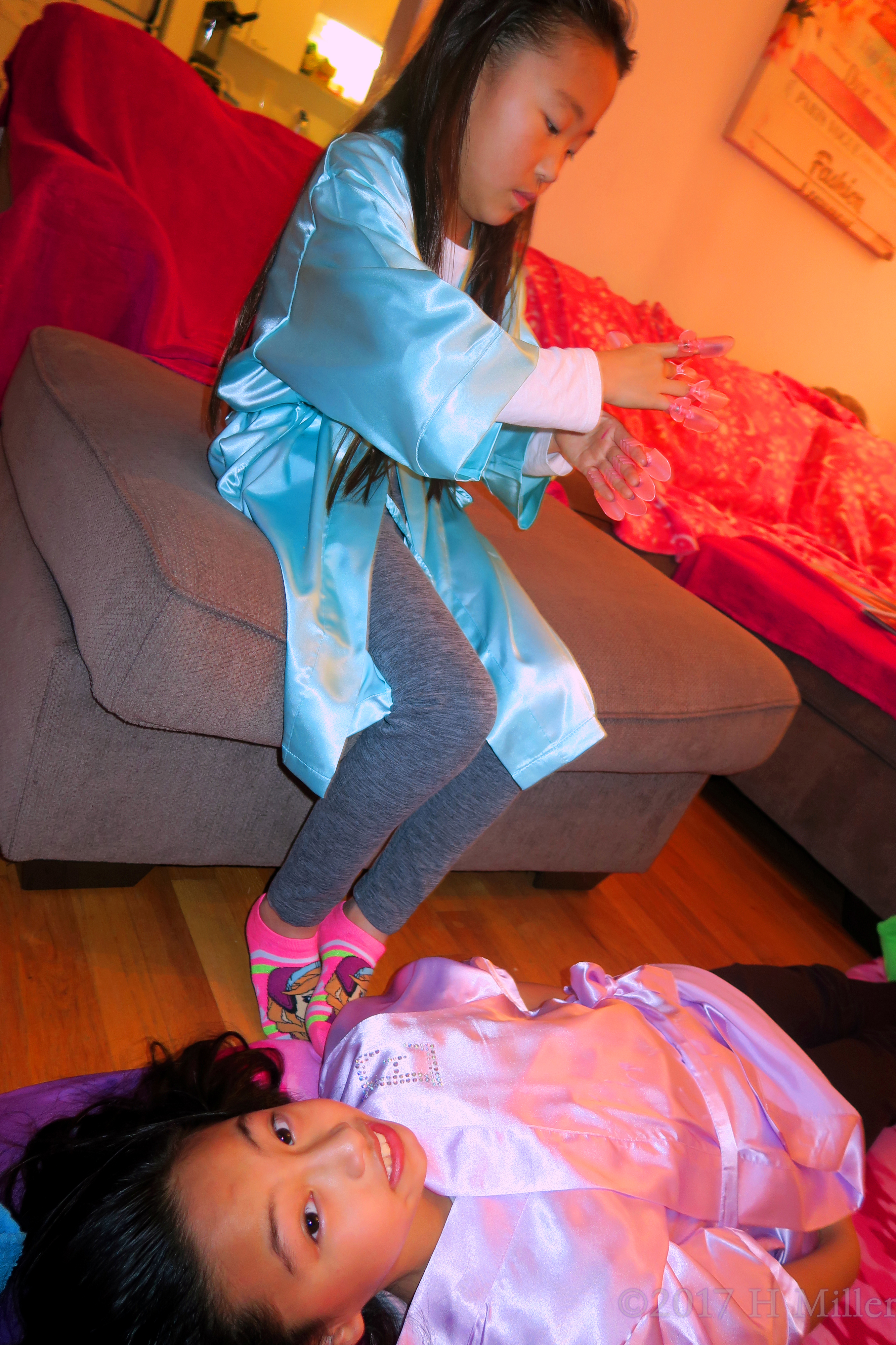 One Adjusting Her Nail Protector While The Other Waits Her Girls Facial To Begin! One Adjusting Her Nail Protector While The Other Waits Her Girls Facial To Begin!