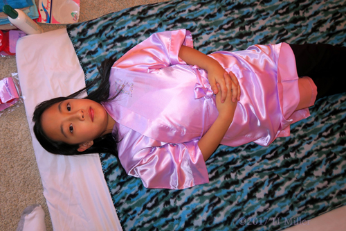 Lying Patiently Waiting For Her Kids Facial Session To Begin Lying Patiently Waiting For Her Kids Facial Session To Begin