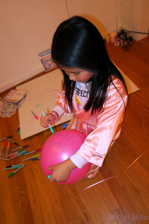 She Decorates The Balloon With A Spa Party Tag!