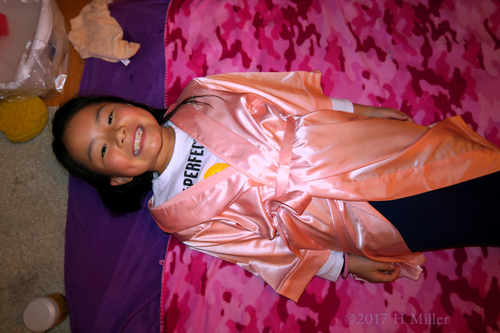 Smiling, While She Waits For Her Kids Facial To Begin. Smiling, While She Waits For Her Kids Facial To Begin.