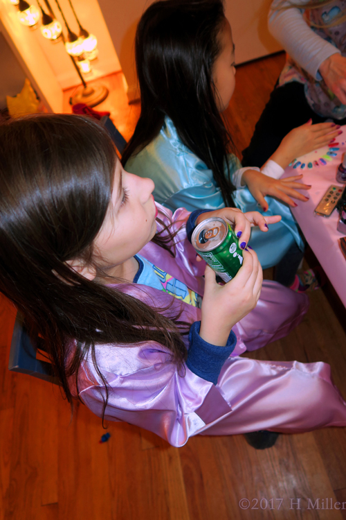 The Girl Having A Softdrink After Her Mani Session.