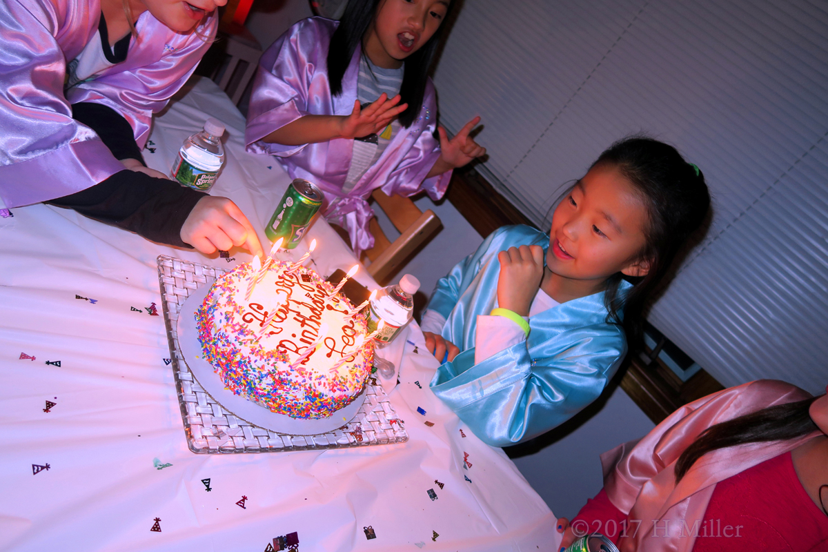 Lea's Friend Lights Up The Birthday Candles. 