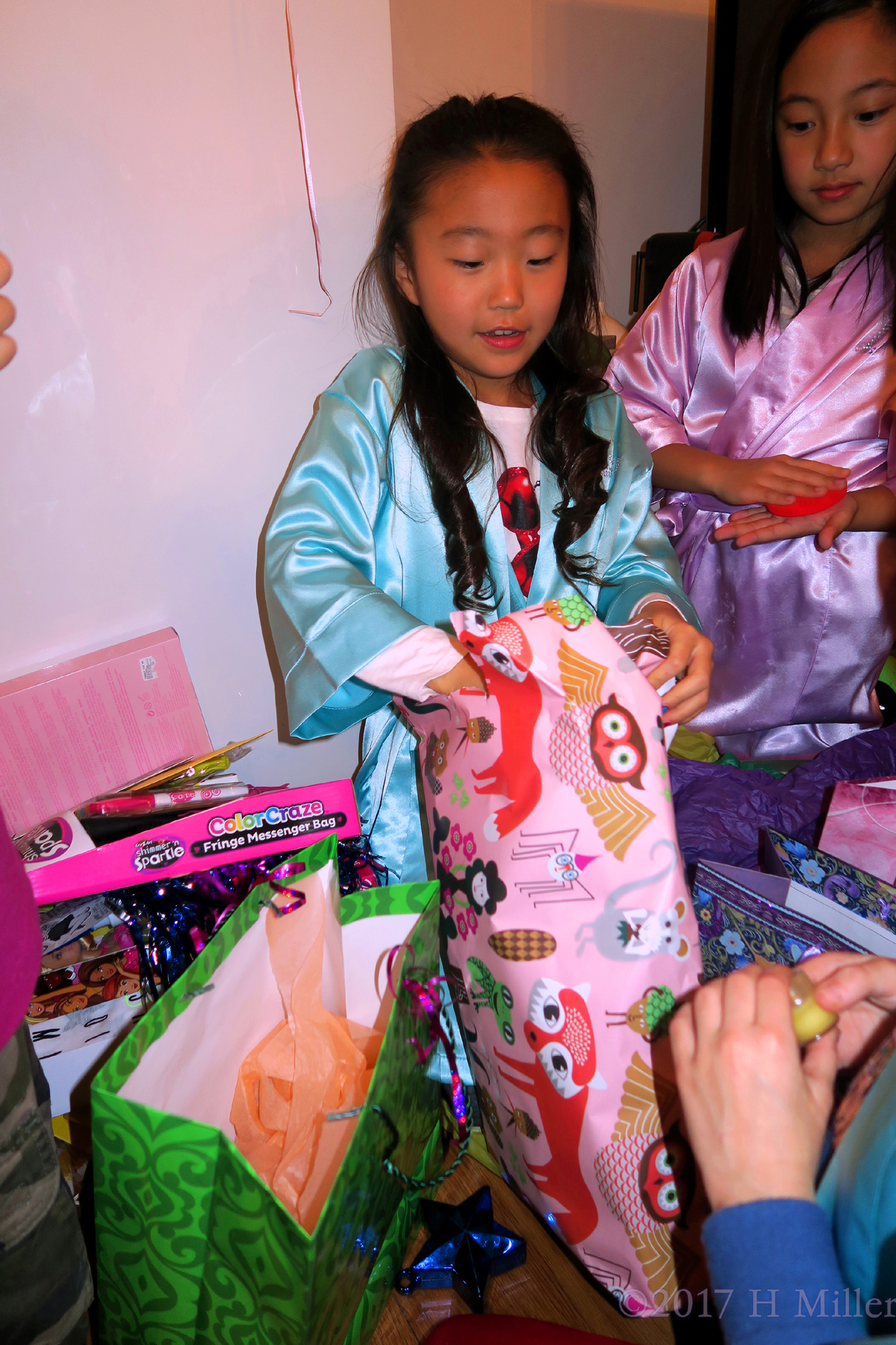 Lea's Happiness Increases With Each Opening Gift. 