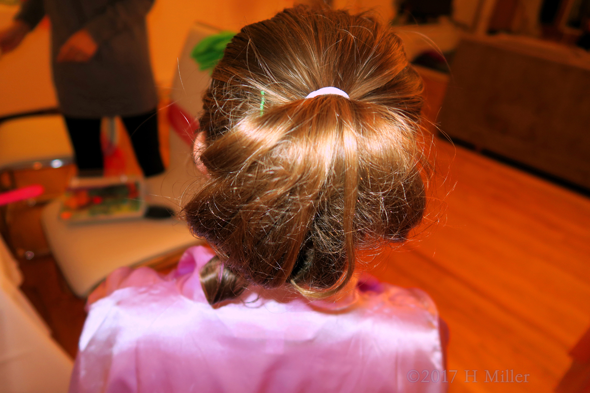 Pony Tail Curved Inside With Slight Curls Is Easy To Go Hairstlye For Kids. 