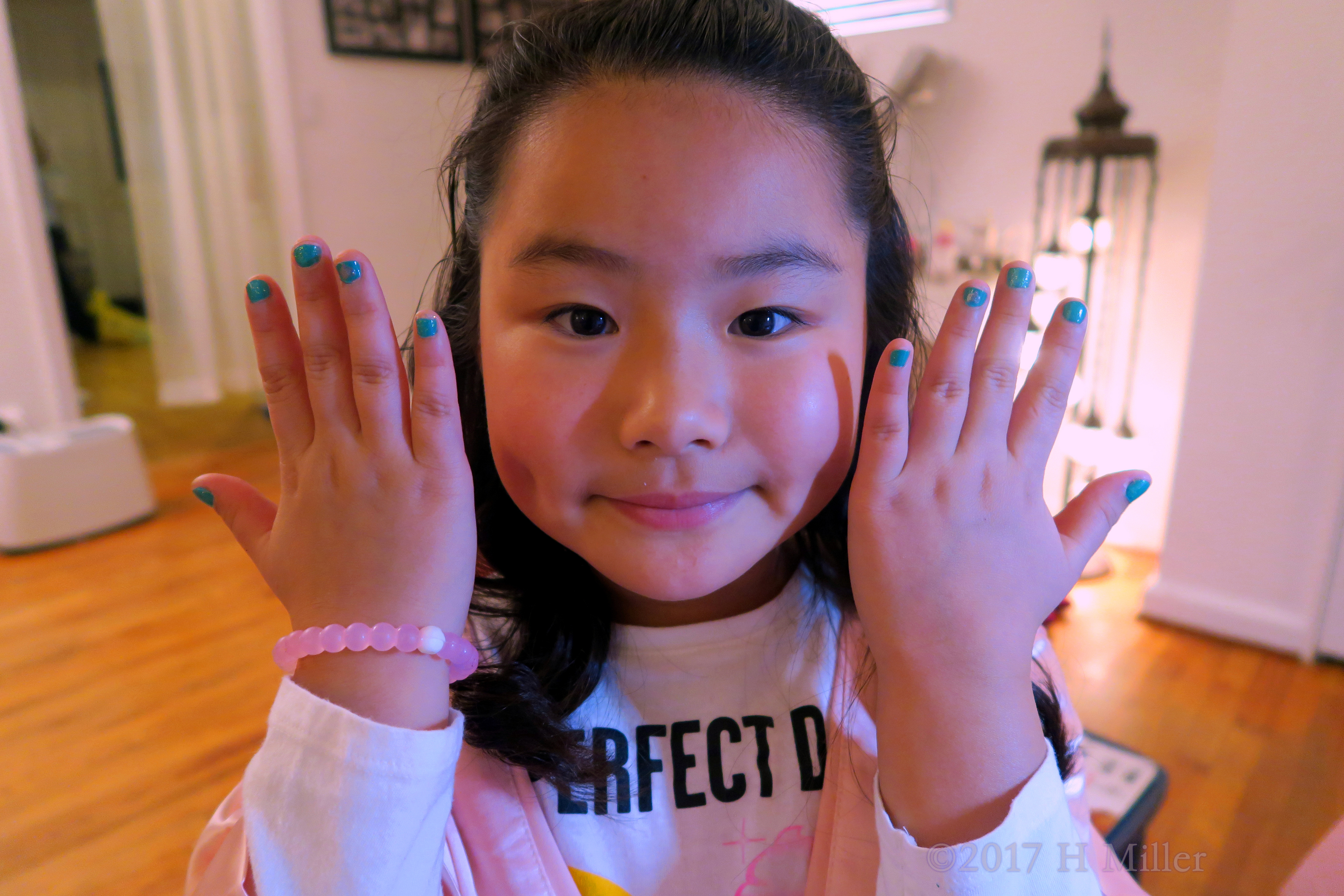 Happily Shows Her Pretty Aqua Mini Mani. 