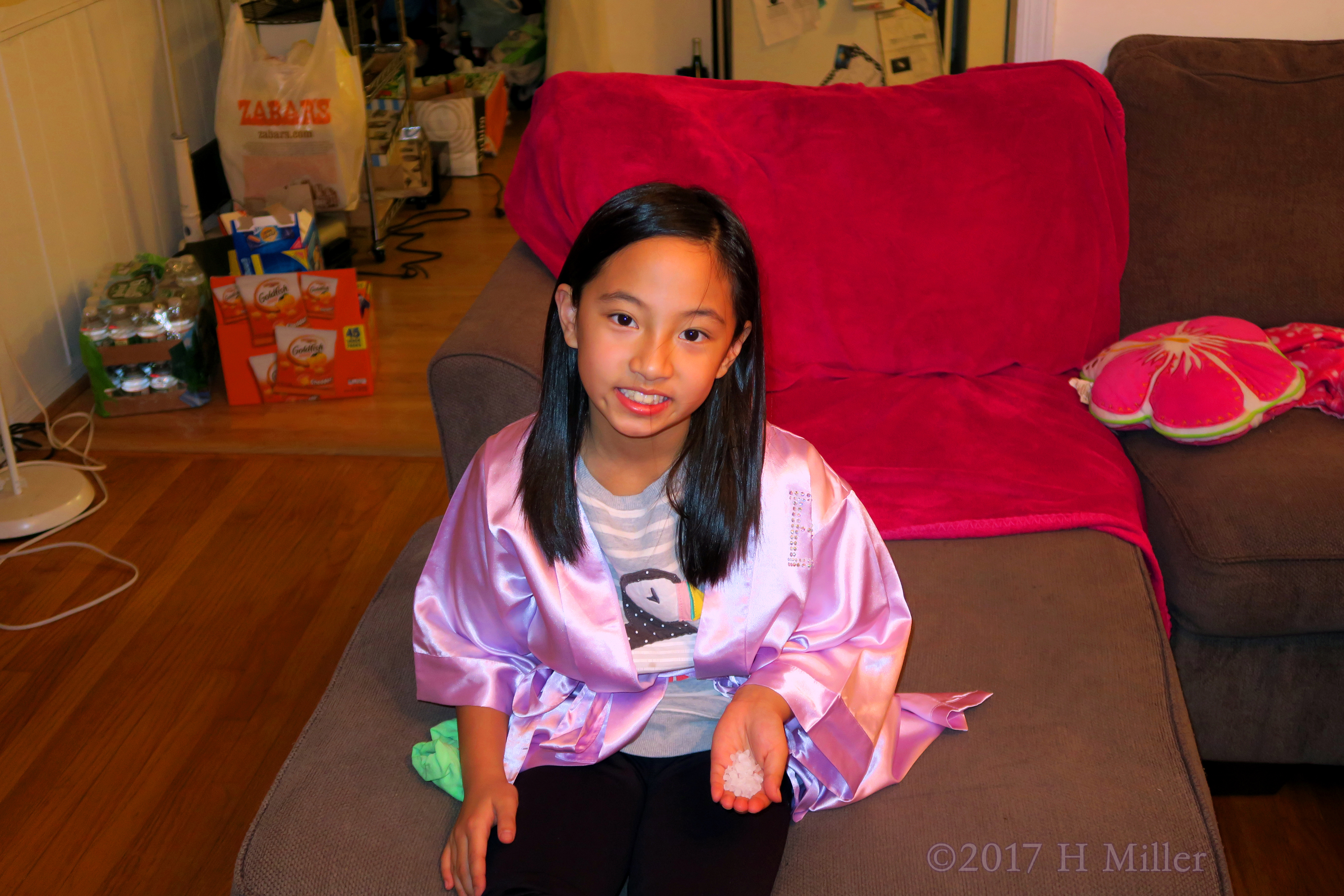 Ready For Kids Pedi Session With Salt In Her Hand. Ready For Kids Pedi Session With Salt In Her Hand.