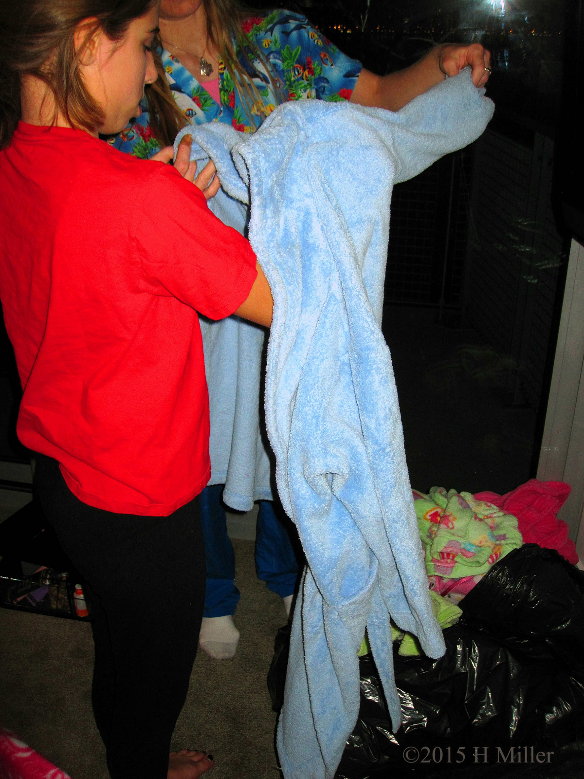 Putting On A Kids Spa Party Robe. 