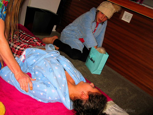 Getting A Pediatric Massage While A Friend Chills Close By. Getting A Pediatric Massage While A Friend Chills Close By.