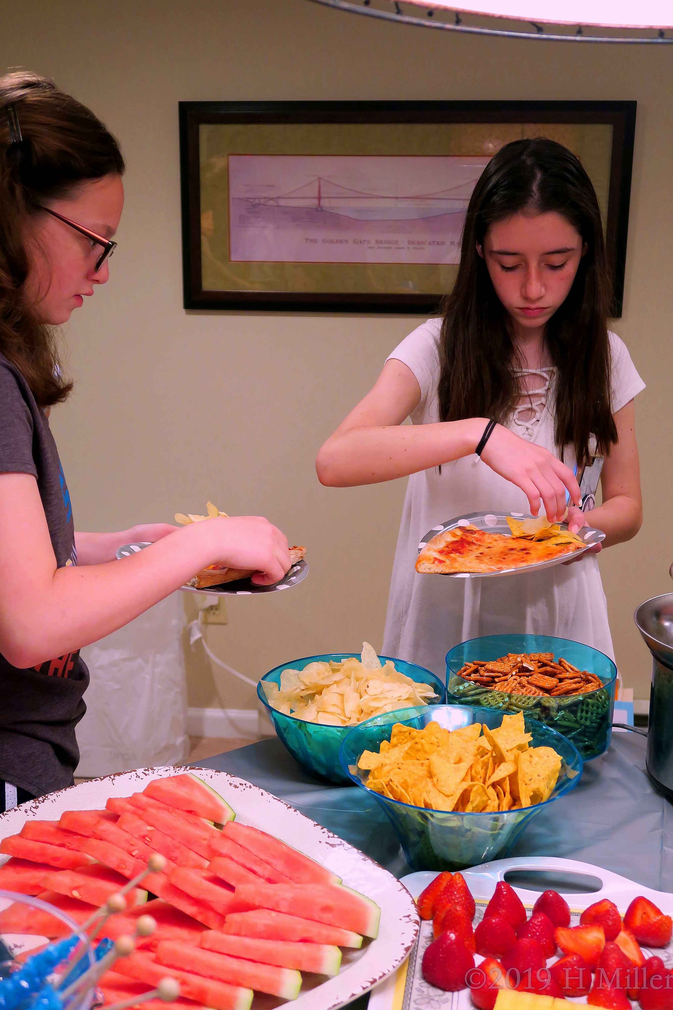 Girls Enjoying Birthday Snack Spread Girls Enjoying Birthday Snack Spread