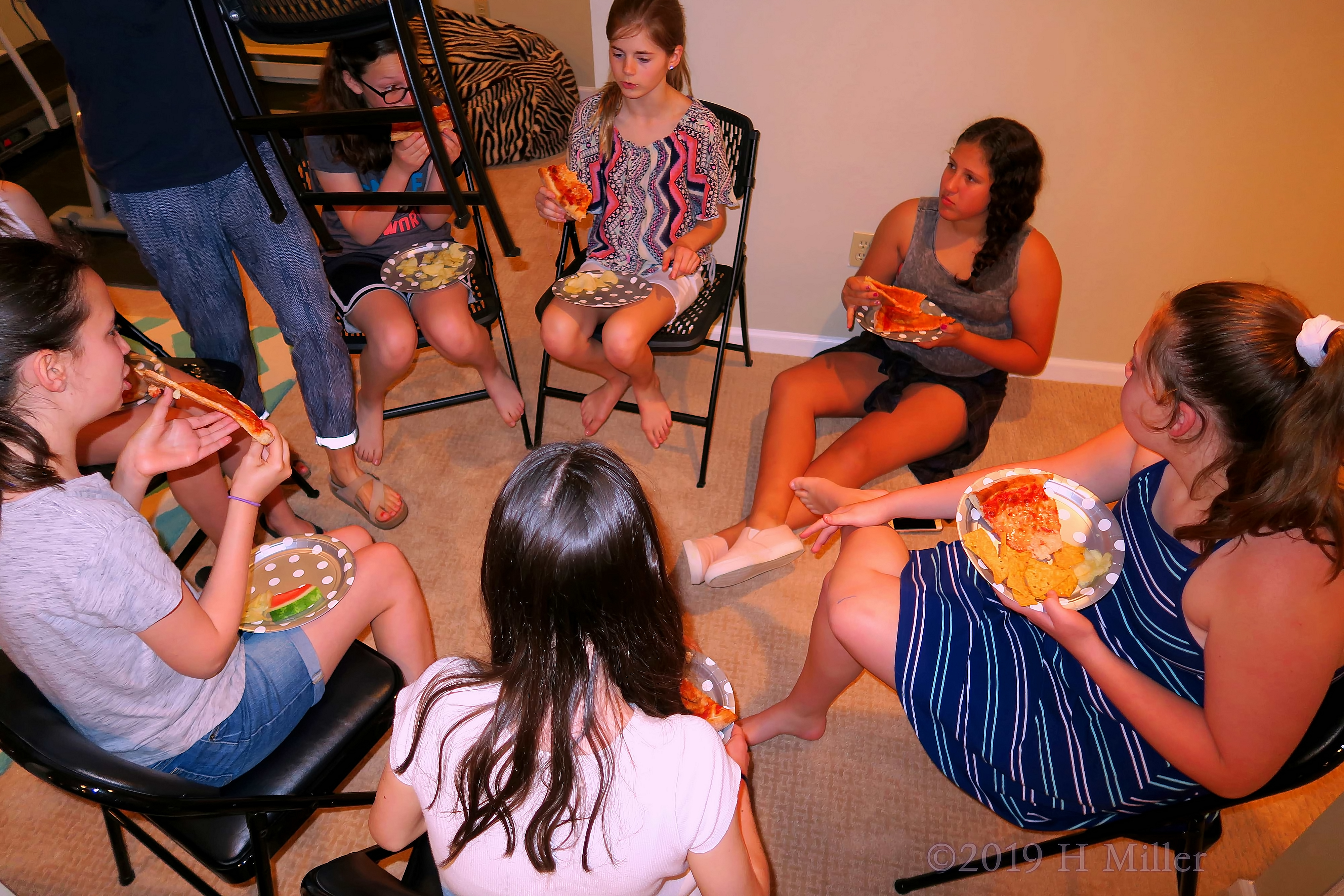 Girls Enjoying Bites Of Birthday Snacks Girls Enjoying Bites Of Birthday Snacks