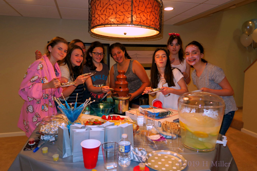 A Group Photo With Mackenzie At The Snacks Table 