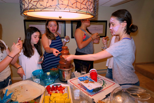Birthday Party Guests Enjoy Chocolate Fountain