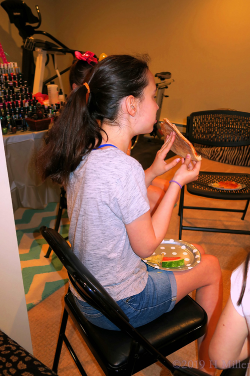 Girl Enjoying Birthday Snacks Girl Enjoying Birthday Snacks