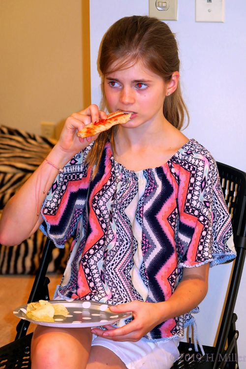 Mackenzie Is Enjoying A Slice Of Pizza Mackenzie Is Enjoying A Slice Of Pizza