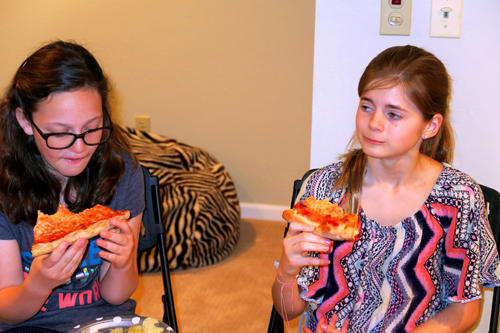 Mackenzie Is Enjoying A Slice Of Pizza With A Friend Mackenzie Is Enjoying A Slice Of Pizza With A Friend