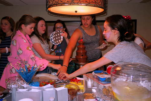 The Birthday Girl And Her Friends Enjoy Yummy Fruit Slices The Birthday Girl And Her Friends Enjoy Yummy Fruit Slices