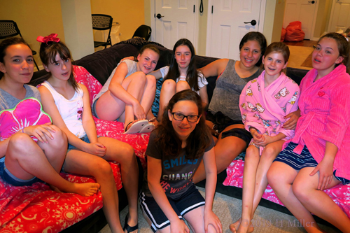 The Birthday Girl Playfully Posing With Her Friends The Birthday Girl Playfully Posing With Her Friends