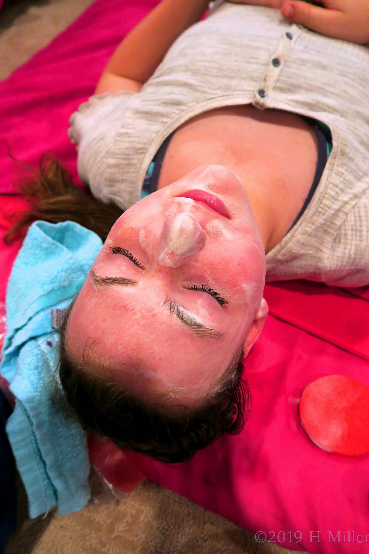 Girl Enjoying Relaxing Facials For Kids On Hot Pink Spa Mat 