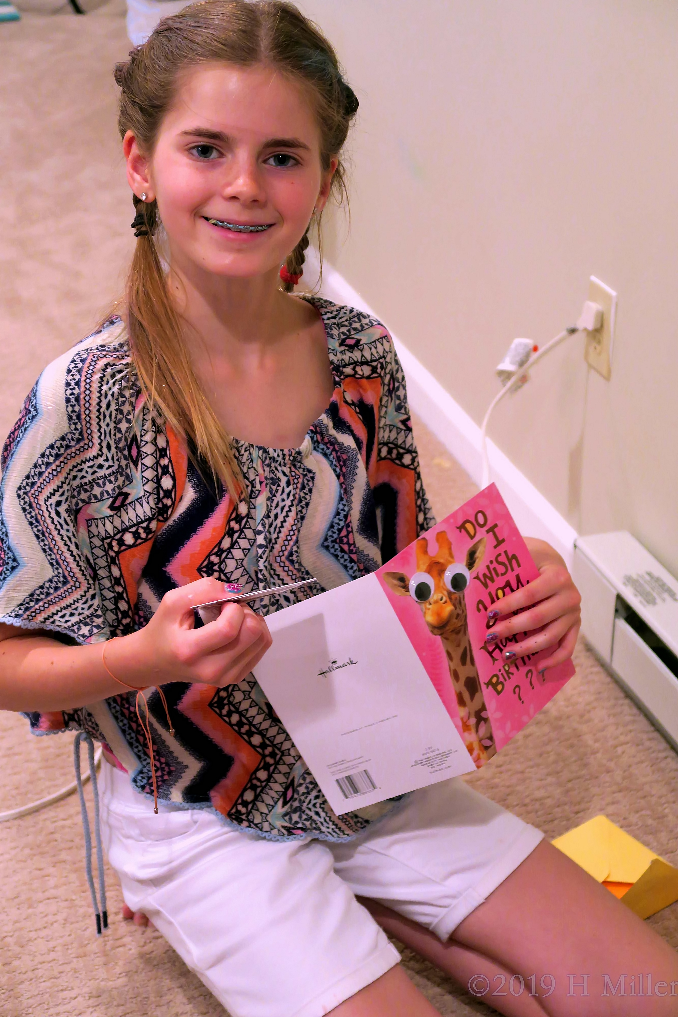 The Birthday Girl Smiling As She Reads Her Cards The Birthday Girl Smiling As She Reads Her Cards