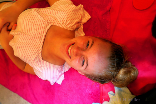 Spa Party Guest Is Smiling Happily Before Her Kids Facial. Spa Party Guest Is Smiling Happily Before Her Kids Facial.