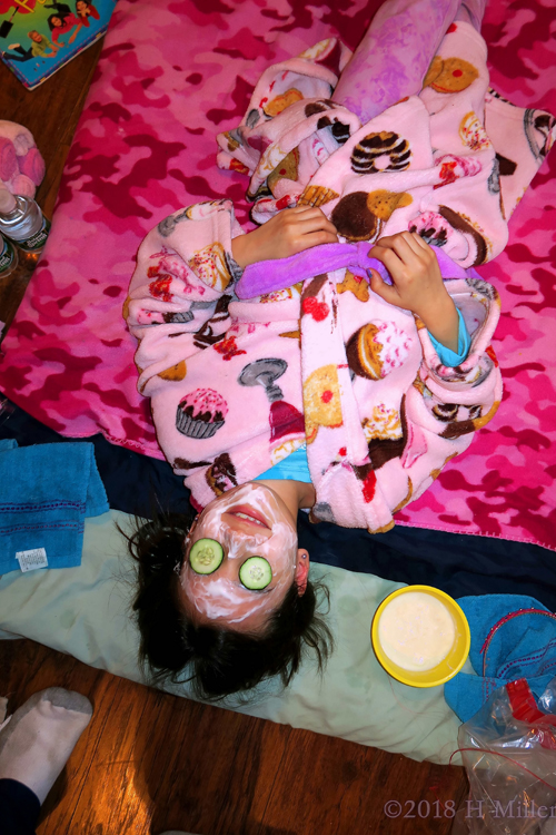 Smiling Spa Girl With Cukes During Kids Facials! Smiling Spa Girl With Cukes During Kids Facials!