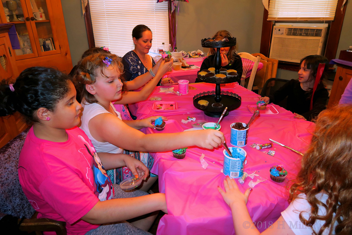 Big Smile While Frosting Is Applied At The Birthday Party 